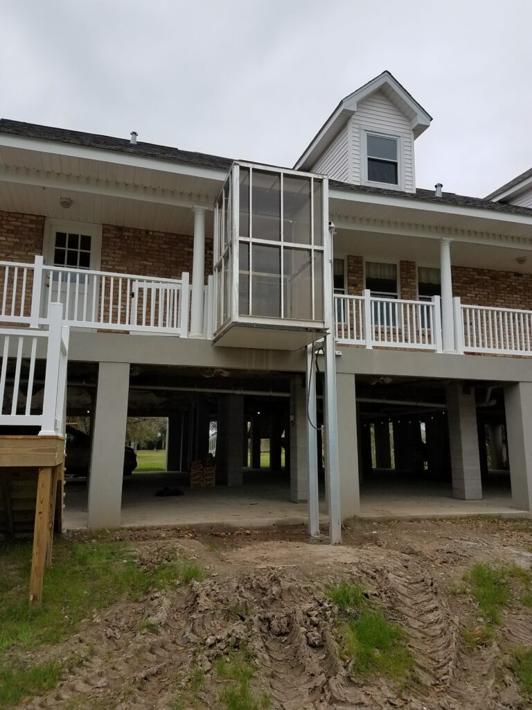 front view of the house with outdoor screen elevator